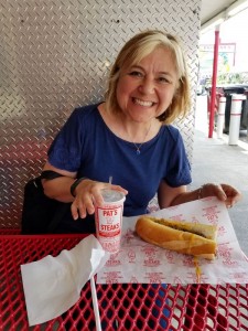 Marion enjoys a cheesesteak from Pat's