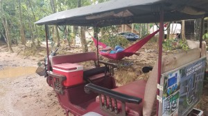 Tucked out tuk tuk driver