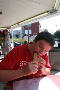 Daniel enjoying his cheese steak