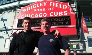 In front of the Wrigley Field sign