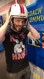 Daniel tries on a helmet