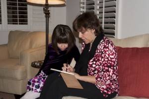 Marion draws Eleyna a picture