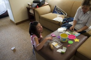 Elayna and marion work on her bead project